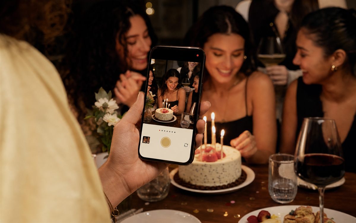 Birthday party guest using Flick on a phone to capture a cake moment